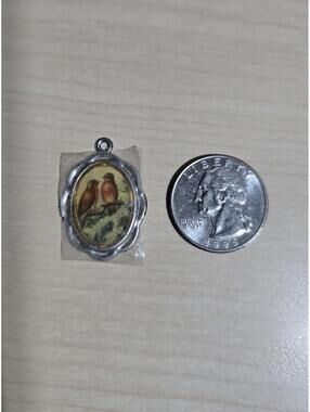 Oval Pendant 2 Birds Sitting On a Branch In A Silvertone Frame
